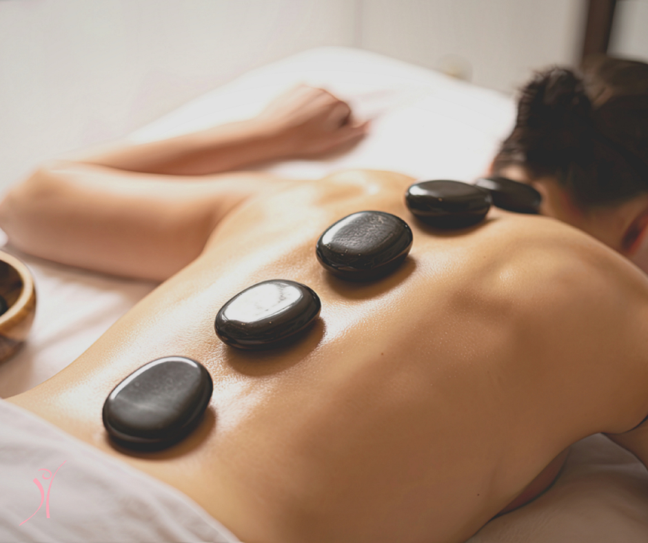 Individual Receiving Hot Stone Massage